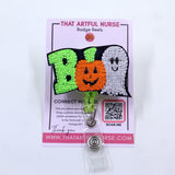 Halloween-themed badge reel with 'BOO' text, featuring a green 'B', an orange pumpkin 'O', and a white ghost 'O'. 