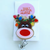 Acrylic Christmas reindeer badge reel with glitter finish, red nose, and colorful lights on antlers.