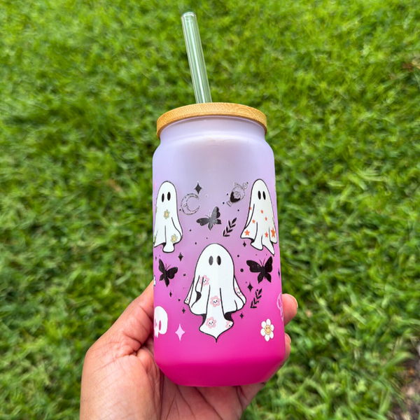 16oz snow globe tumbler with ombre effect featuring Halloween-themed butterflies, moons, sunflowers, crystals, and ghosts – perfect for fall drinks and spooky season vibes.