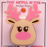 Reindeer-shaped badge reel with pink antlers on a pink background