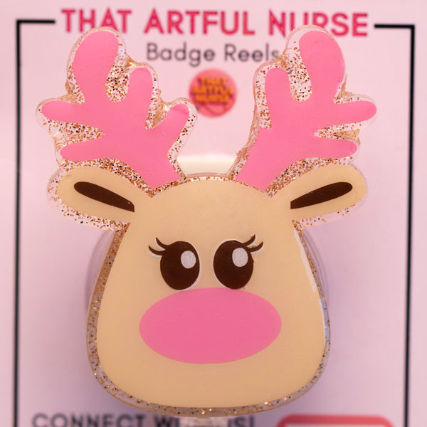 Reindeer-shaped badge reel with pink antlers on a pink background