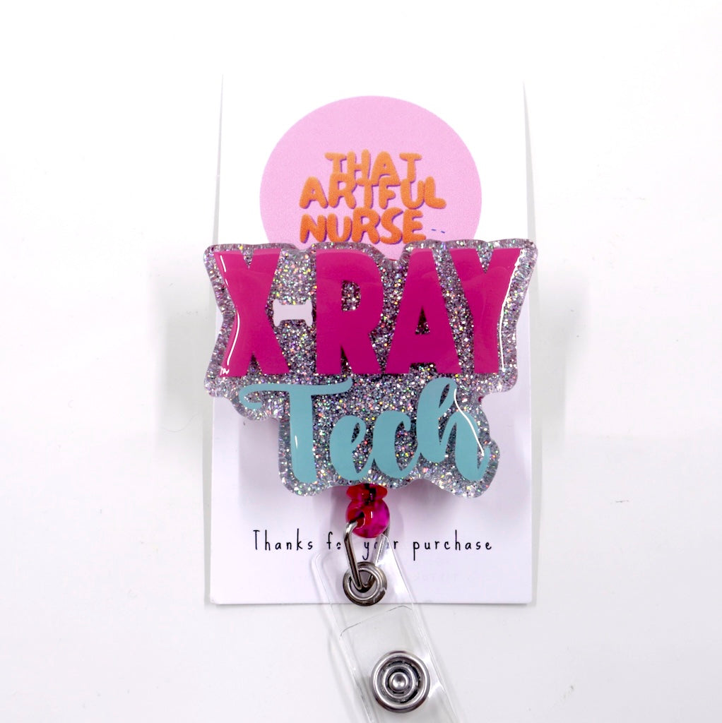 A glittery badge reel with the words "X-RAY Tech" in pink and light blue.