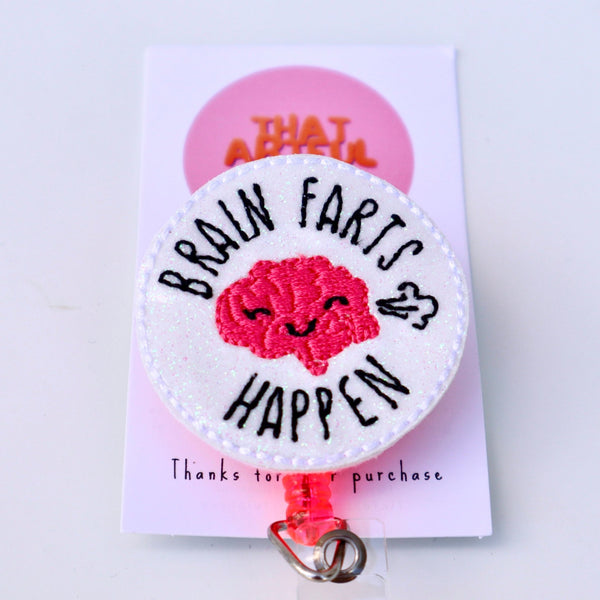 Eye-catching badge reel displaying a brain graphic and the saying "brain farts happen," combining humor with artistic flair.