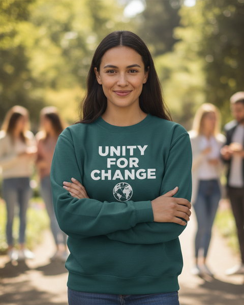 Woman wearing a green sweatshirt with 'Unity for Change' text in a park setting